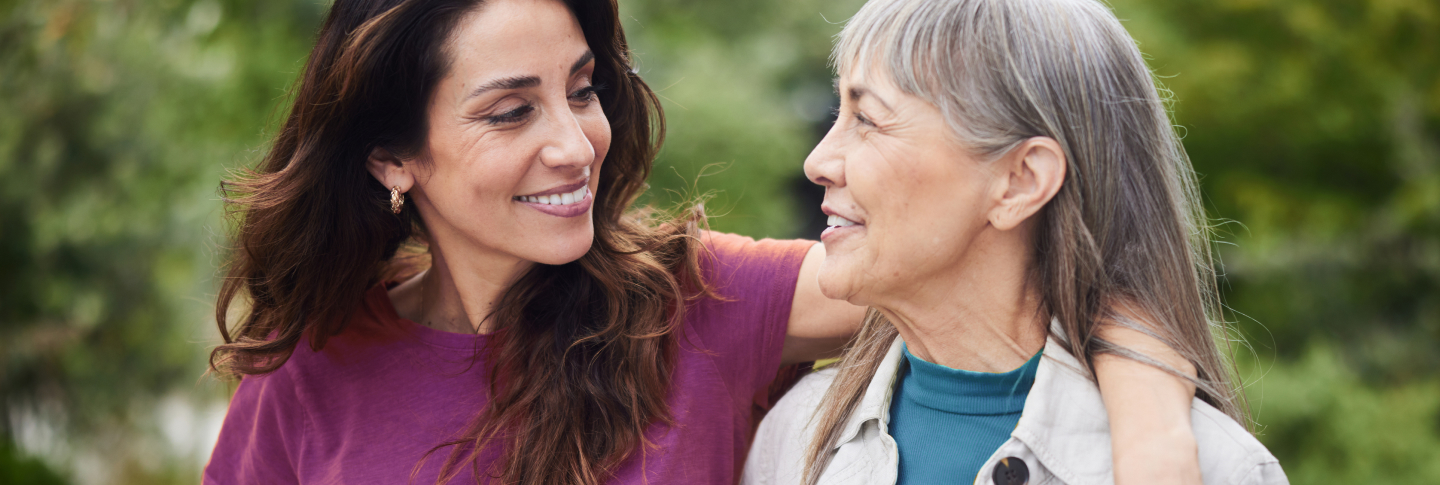 Daughter embracing her mother