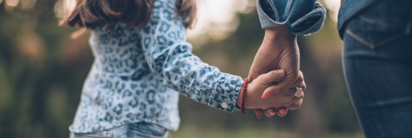 Daughter embracing her mother